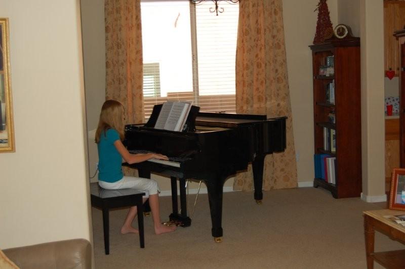 At the same moment, Paige was diligently practicing piano.